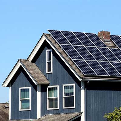 Greenbox Solar Services with residential solar panels on blue house